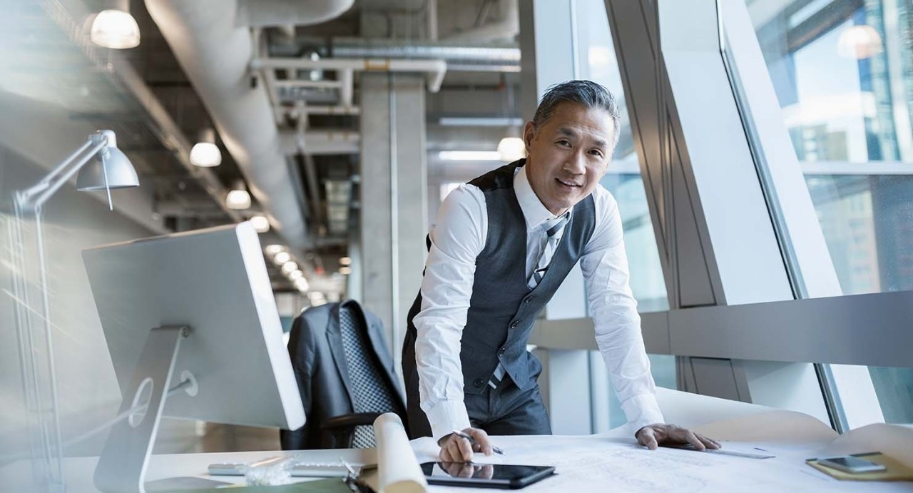 business man in vet in office at desk with tablet and computer