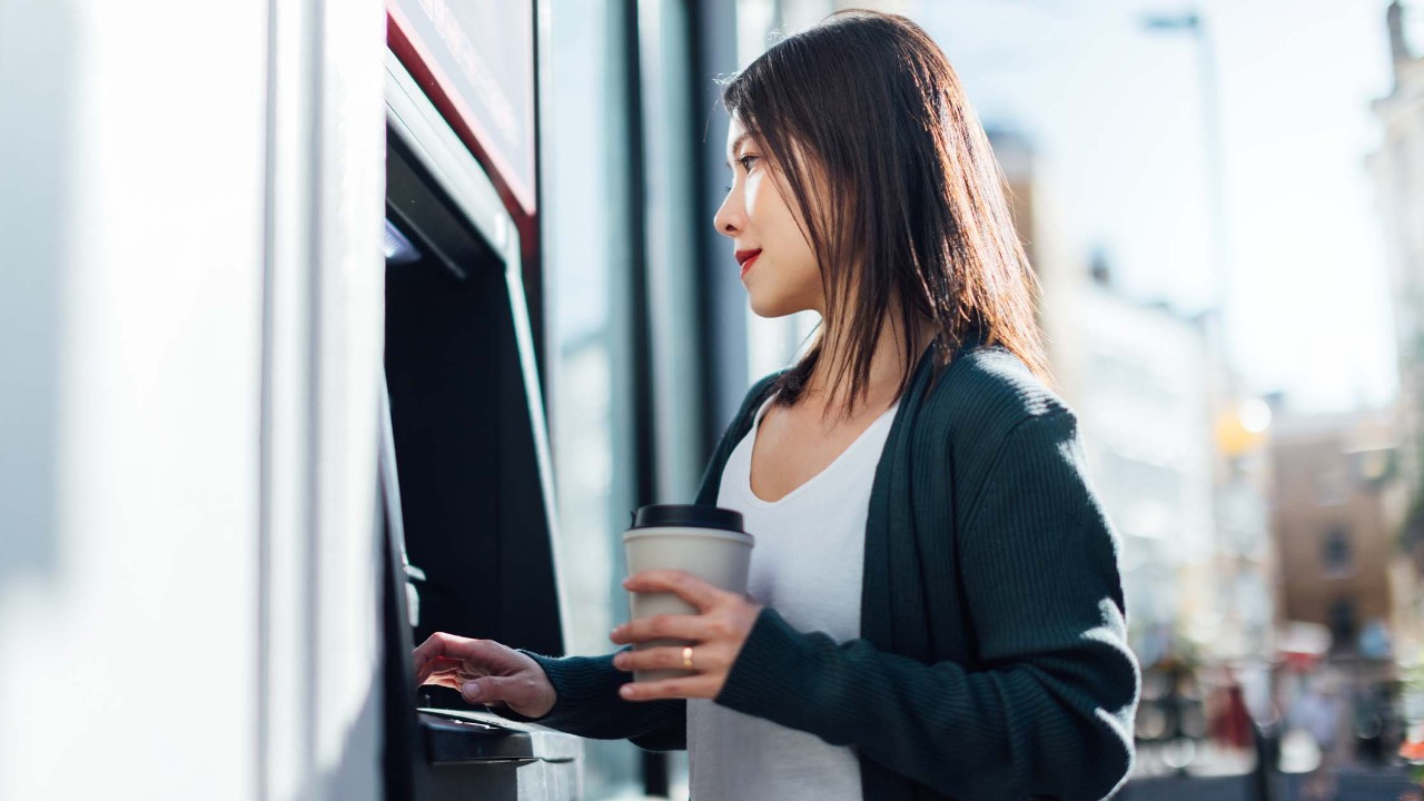 Woman withdrawing at ATM