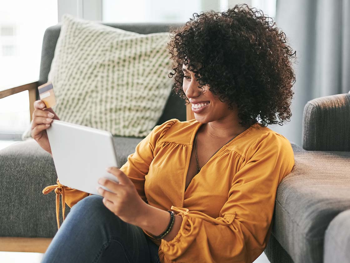 Woman using tablet for shopping online